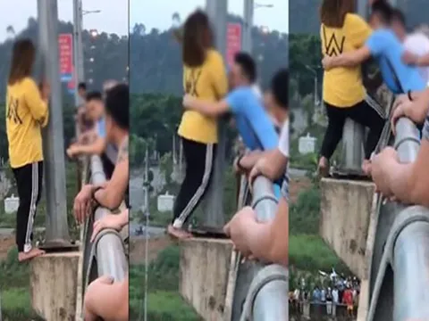 Bế tắc trong cuộc sống, cô gái đang định gieo mình thì được anh chàng áo xanh ôm chặt: Hãy nghĩ đến bố mẹ em đi!