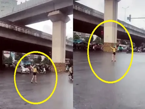 Cô gái đội mũ bảo hiểm, dừng xe đạp để... "đi đường quyền" giữa ngã tư đường khiến nhiều người hoang mang